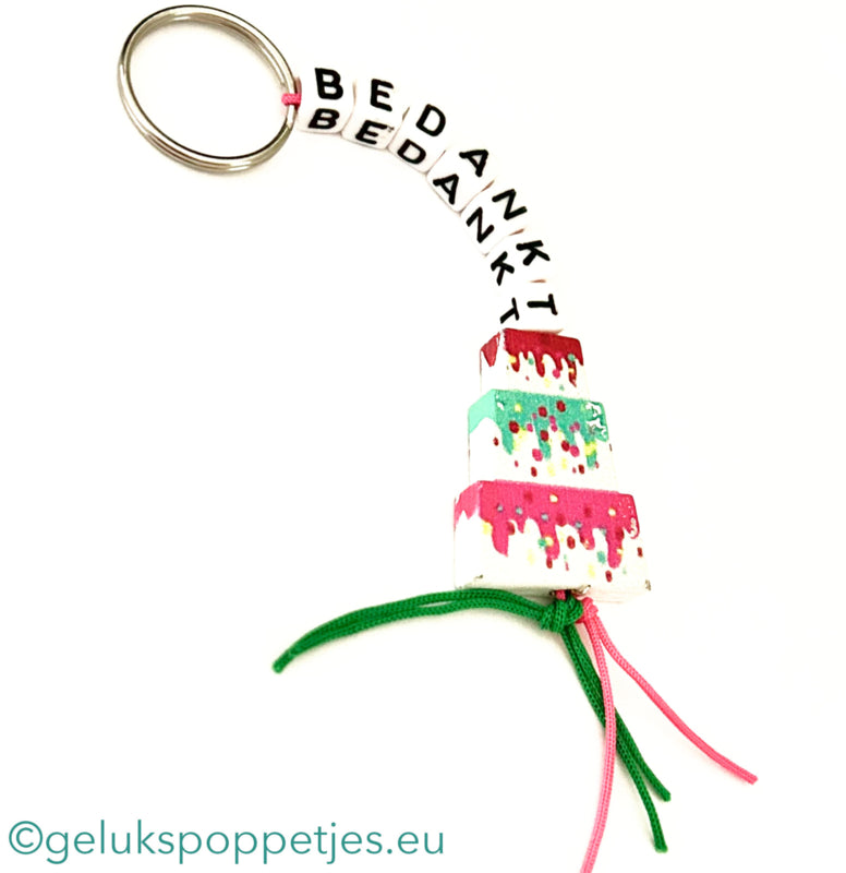 Sleutelhanger bedankt sich mit gelukspoppetje taartje