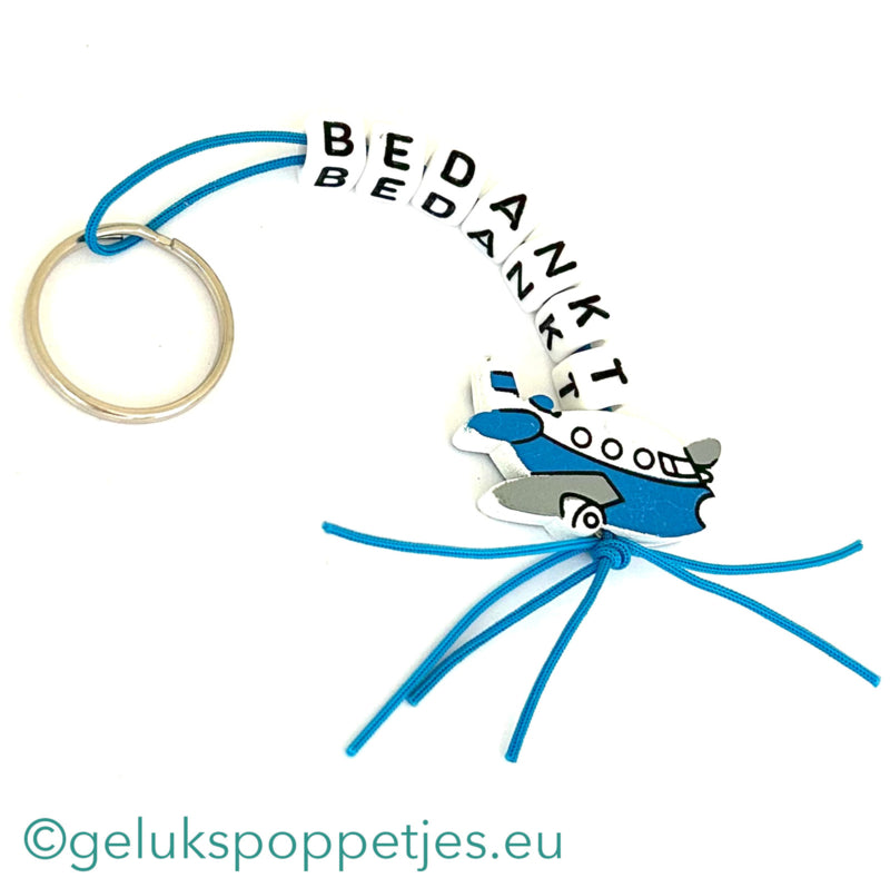 Sleutelhanger bedankt sich mit gelukspoppetje vliegtuig