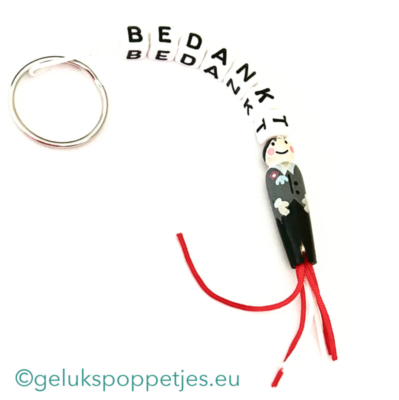 Sleutelhanger bedankt sich mit gelukspoppetje bruidegom