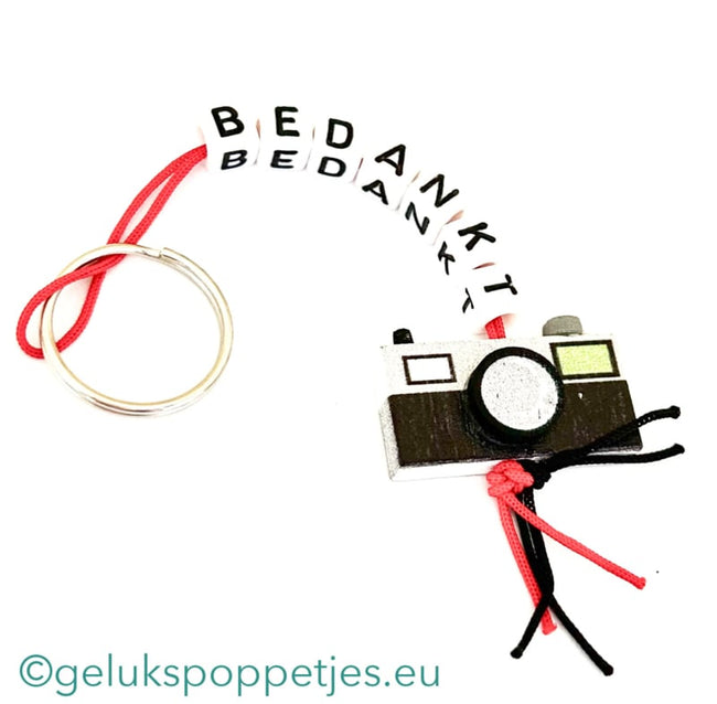 Sleutelhanger bedankt sich mit gelukspoppetje Kamera