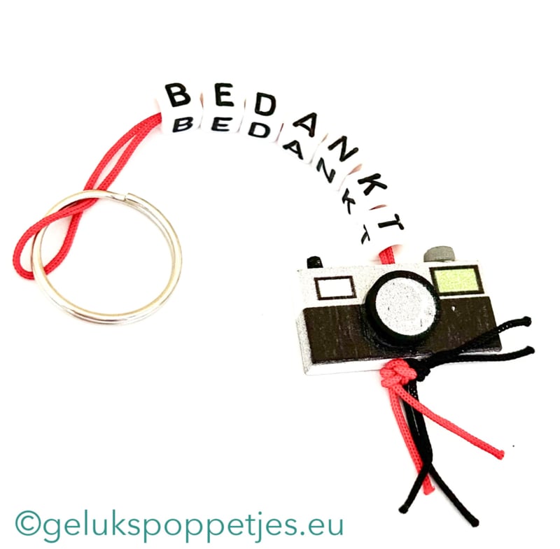Sleutelhanger bedankt sich mit gelukspoppetje Kamera