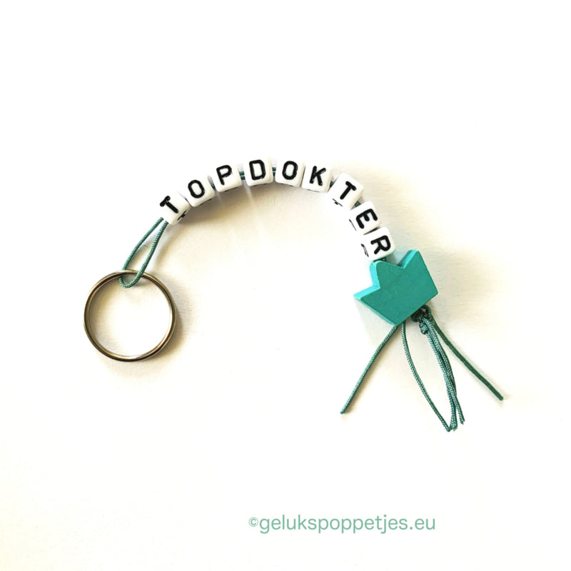 Sleutelhanger topdokter met gelukspoppetje kroontje