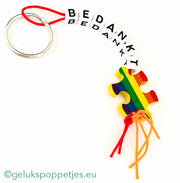 Sleutelhanger bedankt sich mit gelukspoppetje puzzelstukje
