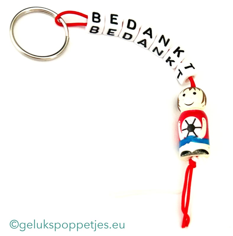 Sleutelhanger bedankt sich bei gelukspoppetje voetballer