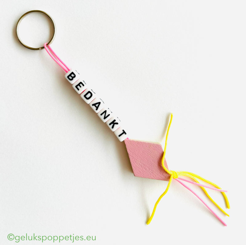 Sleutelhanger bedankt sich mit gelukspoppetje spekje