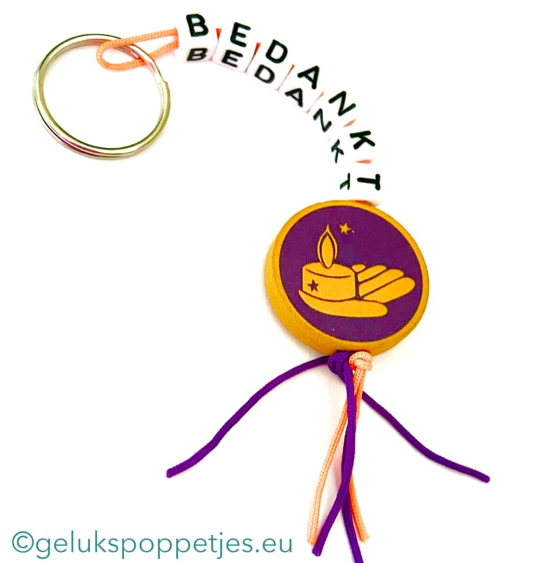 Sleutelhanger bedankt sich mit gelukspoppetje lichtpuntje