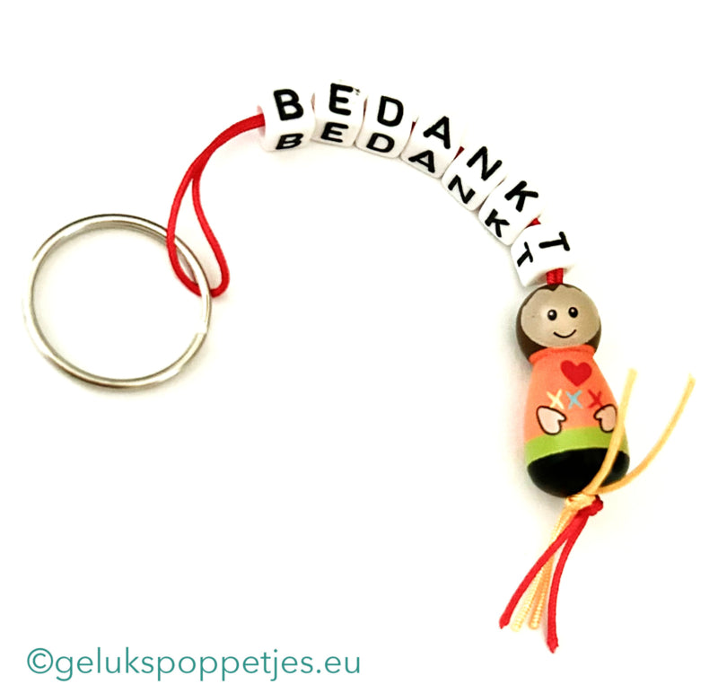 Bedankt sich, dass der Schlüssel mit Gelukspoppetje und Vlecht erfüllt ist