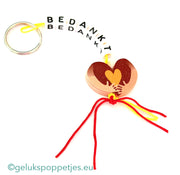 Sleutelhanger bedankt sich mit gelukspoppetje omarm