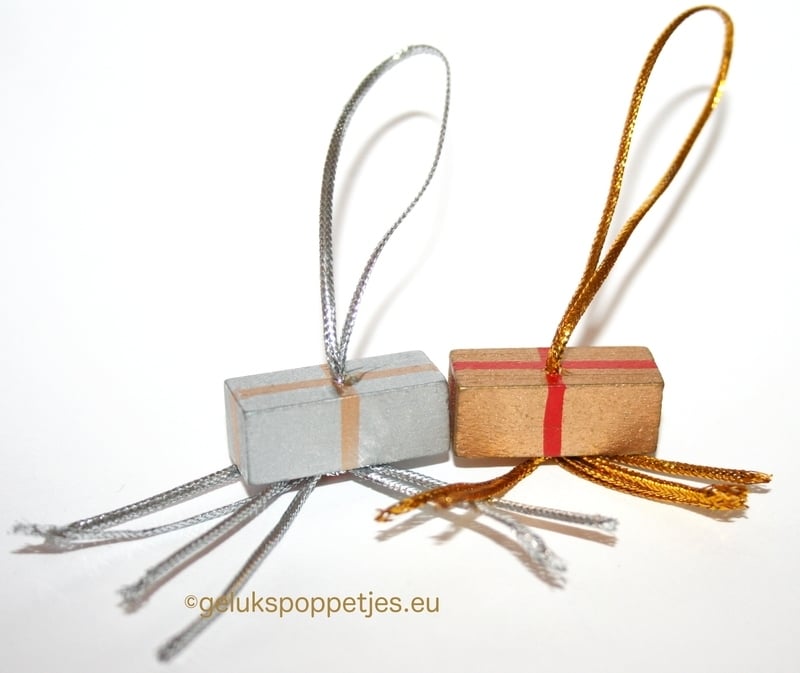 Gelukspoppetje-Geschenkanhänger aus Gold und Silber