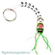 Sleutelhanger bedankt sich mit gelukspoppetje dochter