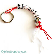 Sleutelhanger bedankt sich mit gelukspoppetje verpleegster