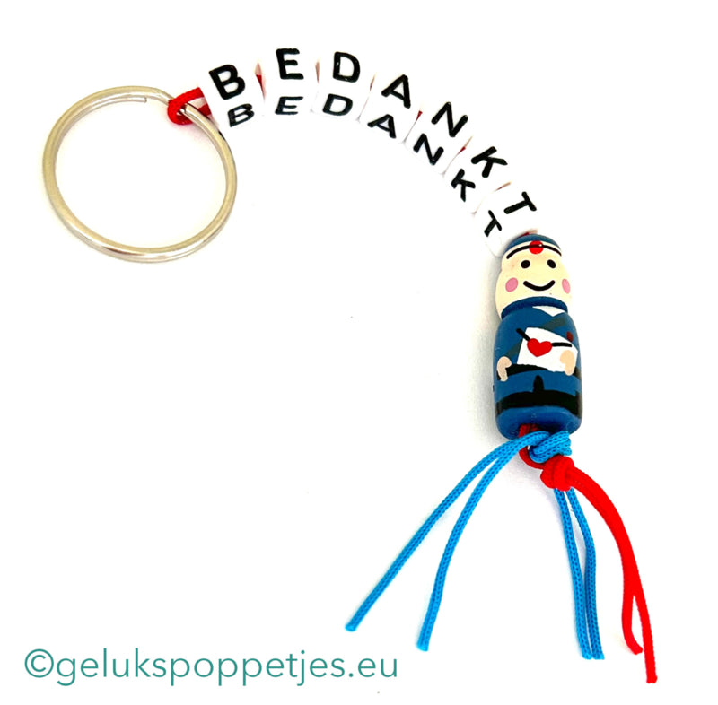 Sleutelhanger bedankt sich mit gelukspoppetje postbode