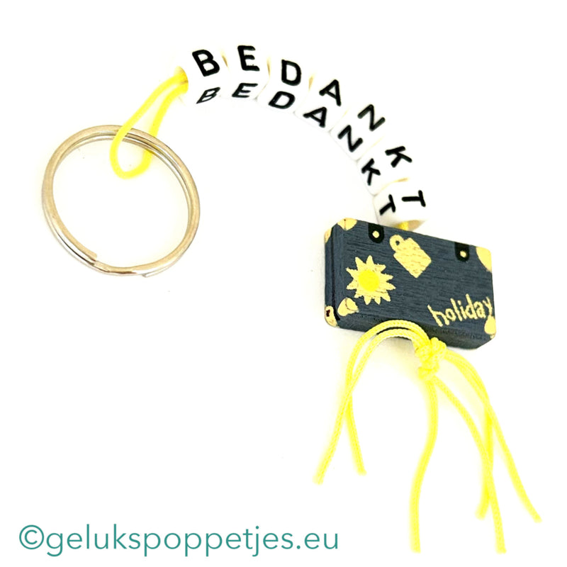 Sleutelhanger bedankt sich mit gelukspoppetje koffertje