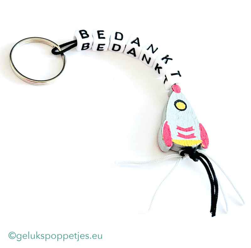 Sleutelhanger bedankt sich mit gelukspoppetje raketje