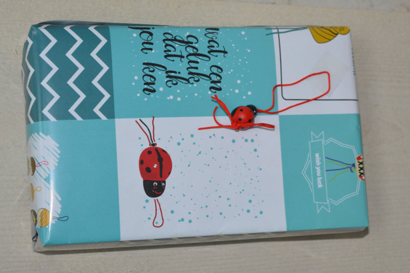 Gelukspoppetjes inpakpapier geblokt