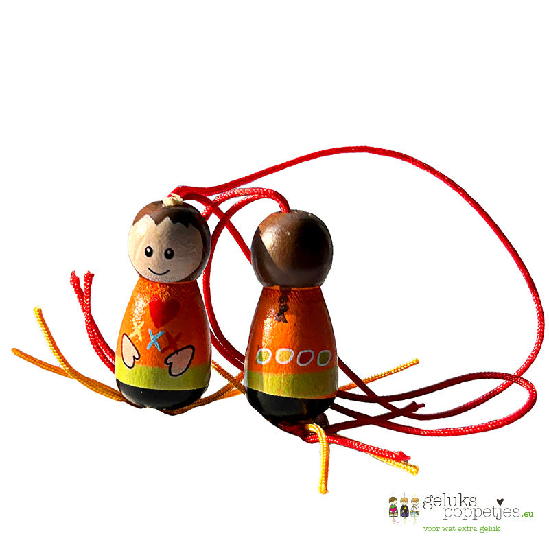 Gelukspoppetje met vlechtje