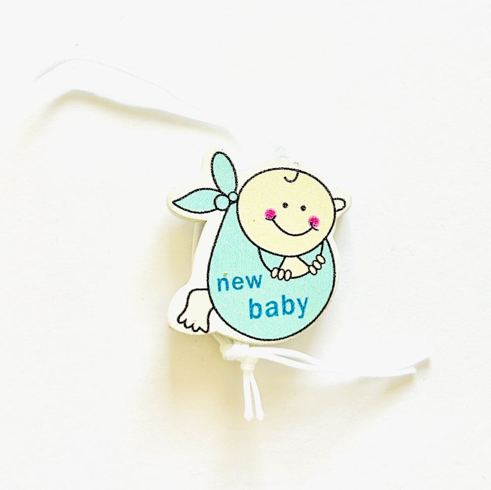 Glücksbringer Baby Junge im Tuch
