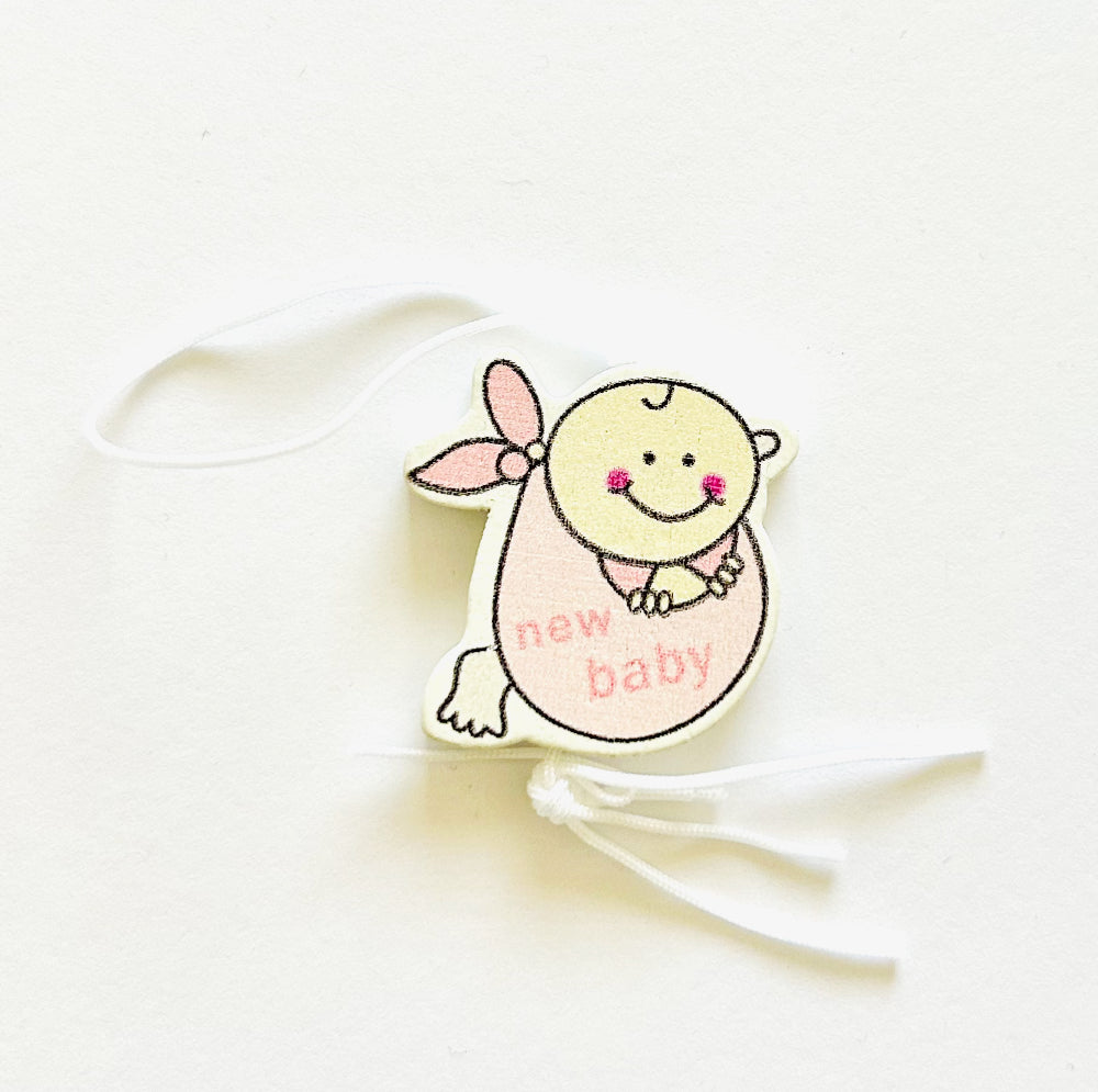 Glücksbringer Baby Mädchen im Tuch