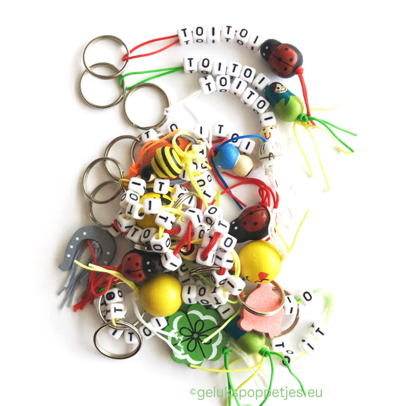 Sleutelhanger bedankt sich mit verschillenden Gelukspoppetjes