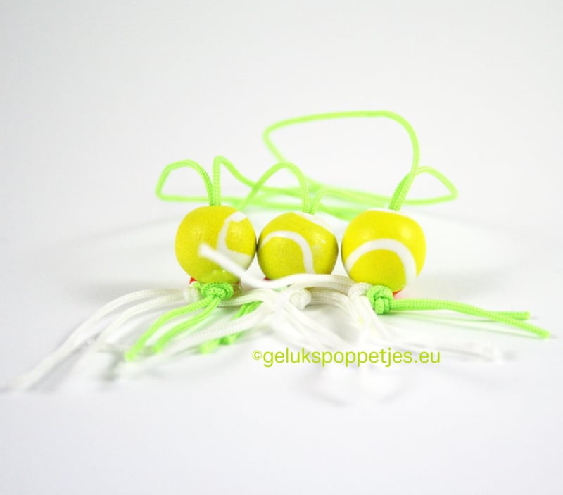 Gelukspoppetje tennisbal