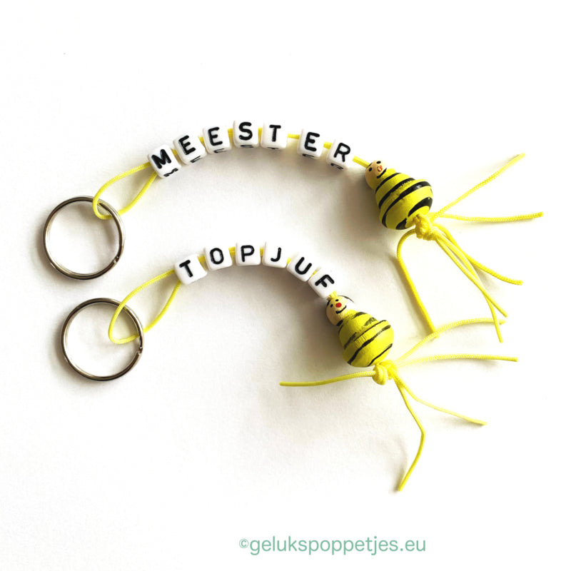 Sleutelhanger meester met gelukspoppetje bijtje