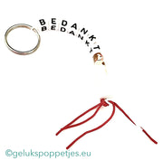 Bedankt sich am Schlüsselbund und gelukspoppetje bruidje