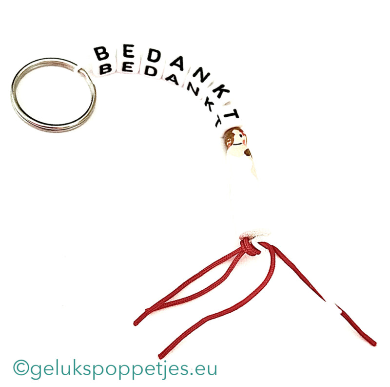 Bedankt sich am Schlüsselbund und gelukspoppetje bruidje