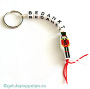 Sleutelhanger bedankt sich mit gelukspoppetje notenkraker